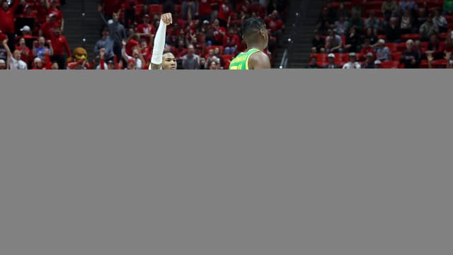Jan 21, 2024; Salt Lake City, Utah, USA; Utah Utes guard Deivon Smith (5) holds his follow through after making a three point shot against the Oregon Ducks during the second half at Jon M. Huntsman Center. Mandatory Credit: Rob Gray-USA TODAY Sports